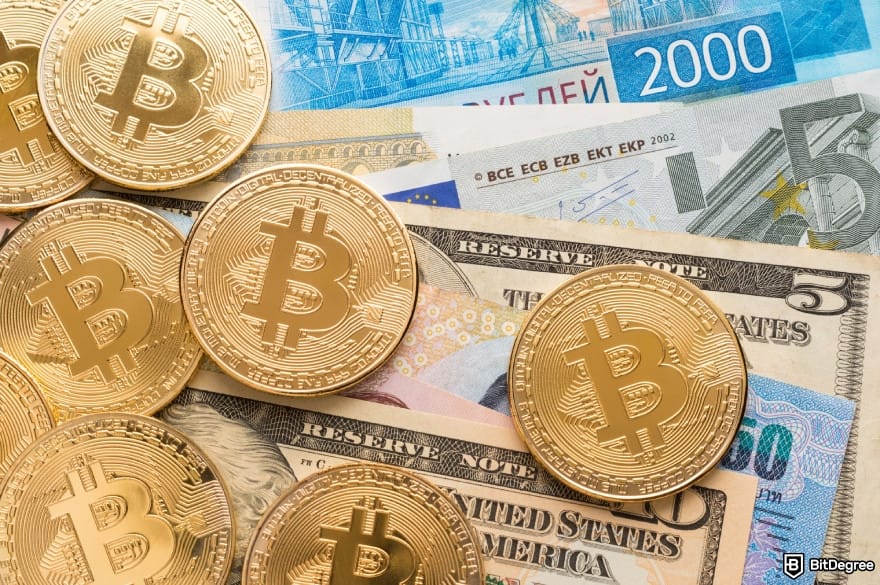 Coinbase taxes: Bitcoins lie on banknotes.