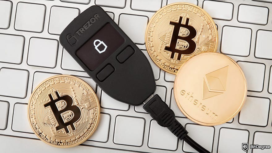 Cold wallet: Trezor wallet on a keyboard.