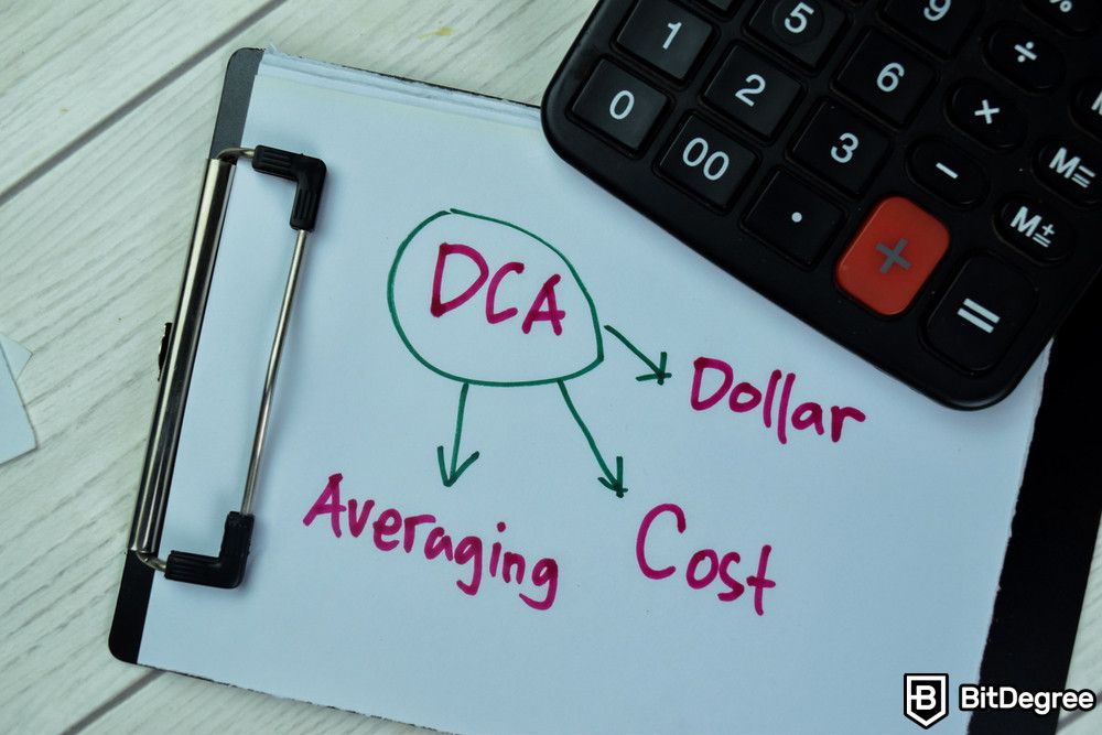 Crypto ETF: Dollar Cost Averaging written on a paper near a calculator on a wooden table.