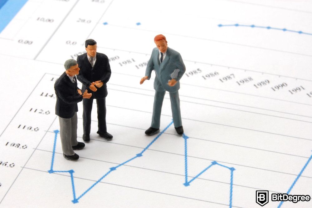 Crypto ETF: three businessmen figurines on economic charts.