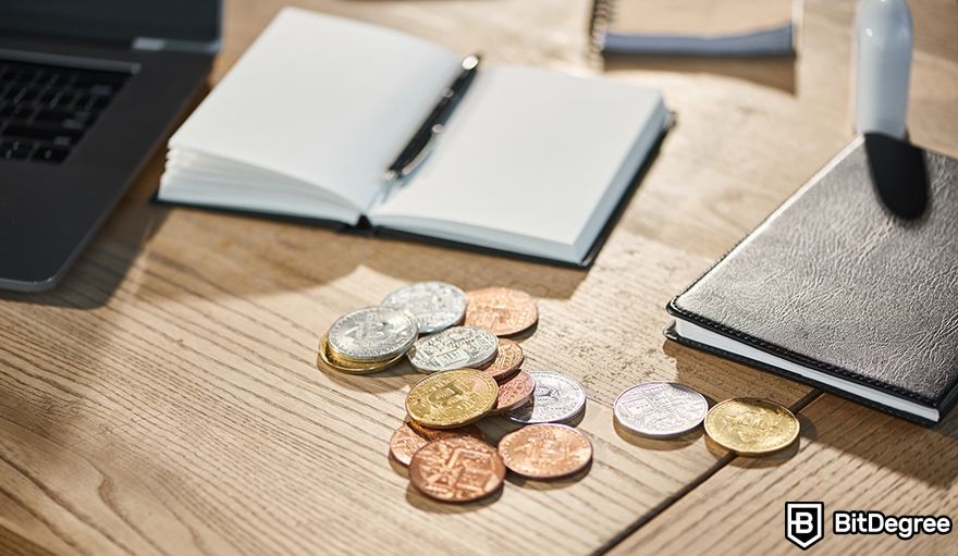 Crypto options trading: coins and notebooks on a table.