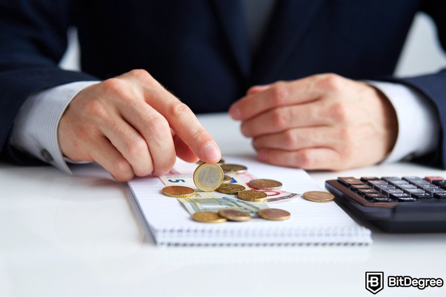 Crypto tax-loss harvesting: a person counting coins.