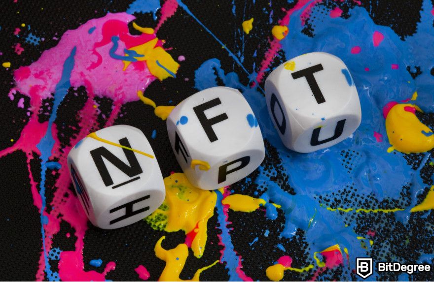 Crypto tax-loss harvesting: three dice with the letters NFT.