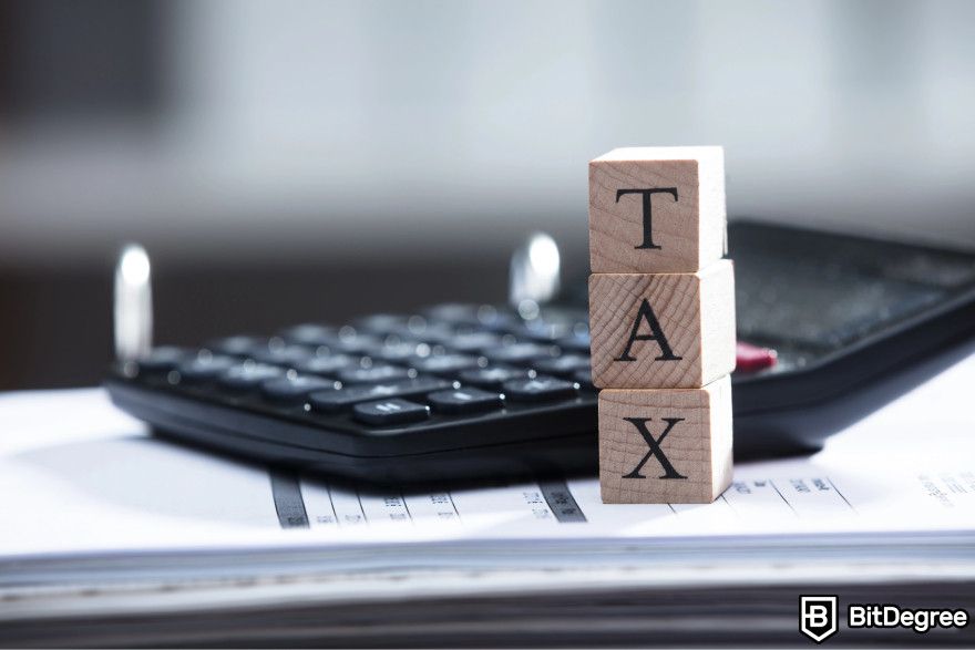 Crypto tax-loss harvesting: a vertical pile of wooden blocks forming the word. 