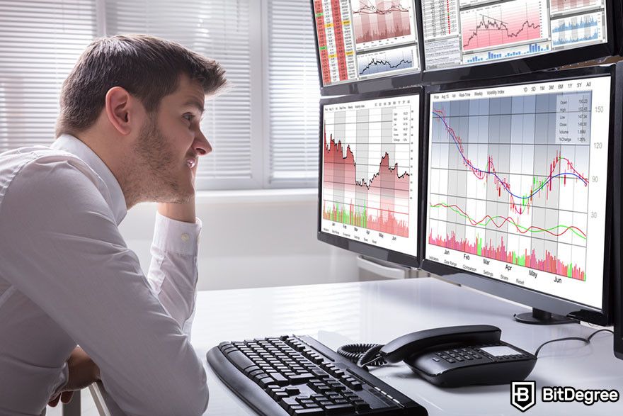 Crypto vs stocks: trader monitoring multiple screens displaying stock charts and financial data.