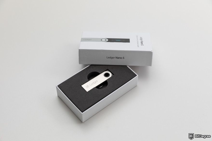 Crypto wallet security: a close up of brand new cryptocurrency hardware wallet Ledger Nano S.