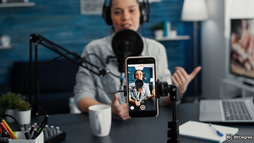 Cryptocurrency jobs: a content creator recording a video.