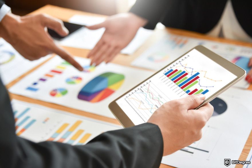 Cryptocurrency jobs: interpreting visualized data in a meeting.