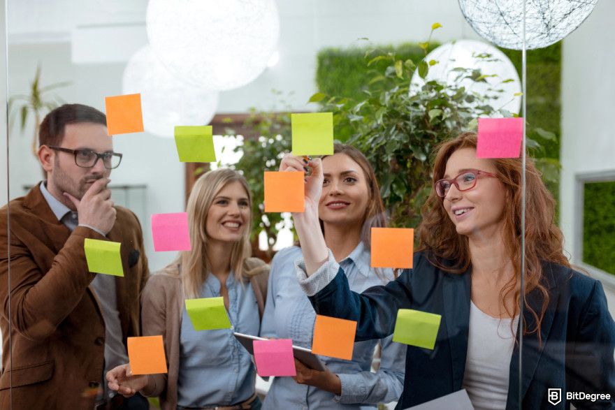 Cryptocurrency jobs: marketing specialists brainstorming ideas.