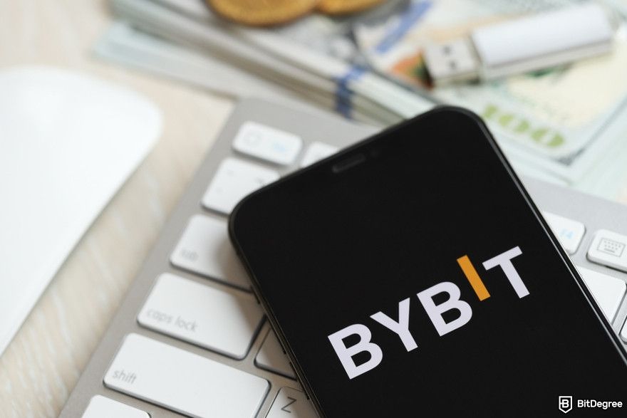 Cryptocurrency security: a smartphone showing the Bybit logo on its screen.