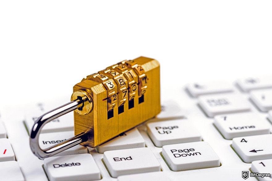 Cryptocurrency security: padlock on a white keyboard.