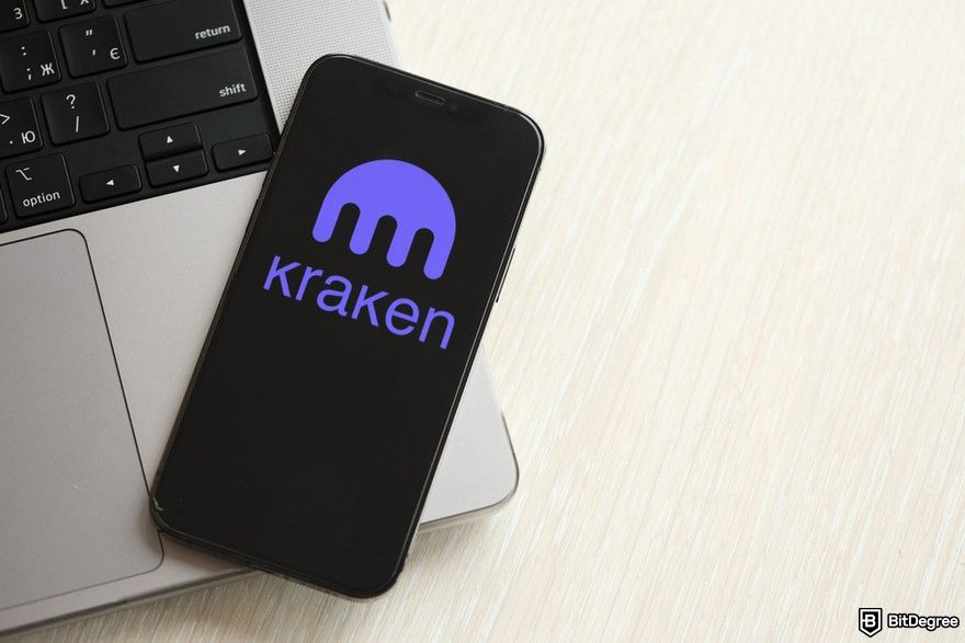 Cryptocurrency security: a smartphone showing the Kraken logo on its screen.