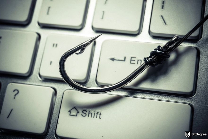 Cryptocurrency security: a fishing hook on a computer keyboard.