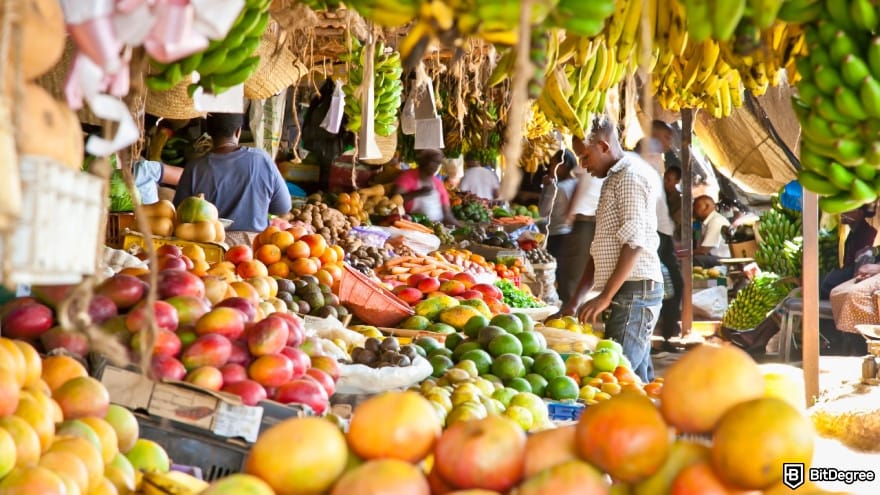 Currency devaluation in Nigeria: ripe fruits stacked at a local fruit and vegetable market.