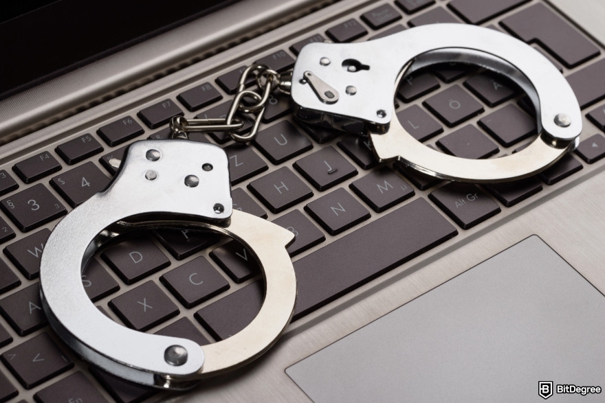 Decentralization vs. Government Control: The Battle for Financial Freedom: handcuffs on a laptop.