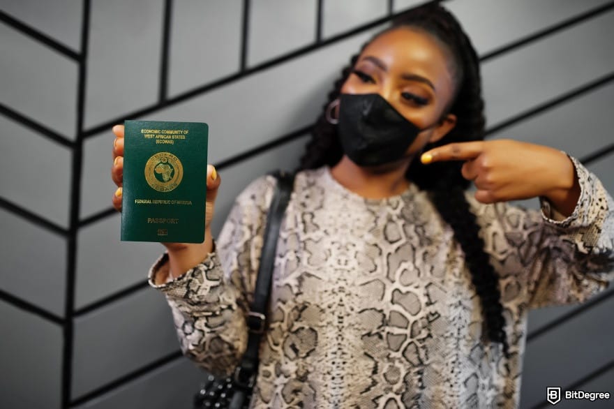 Does Wise work in Nigeria: a woman holding a Nigerian passport.