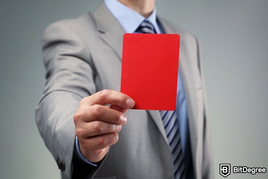 Ethereum staking: a businessman holding a red card.