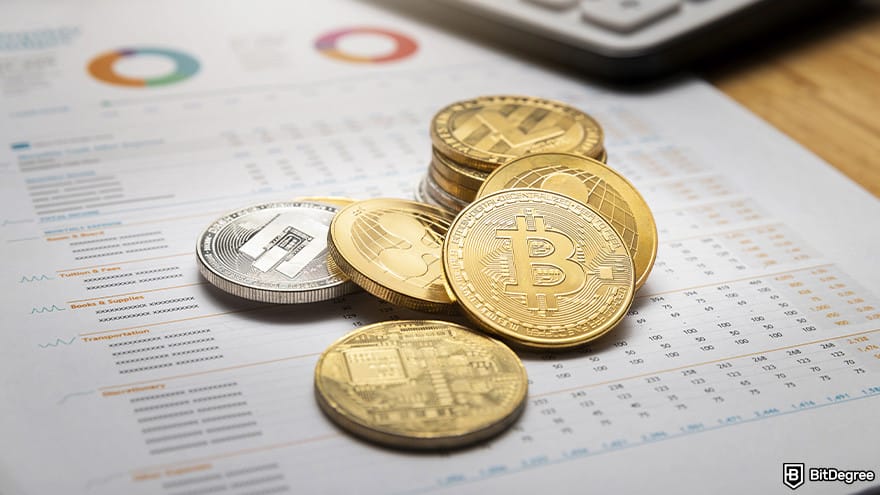 Free Cloud Mining: Various cryptocurrencies on a table.