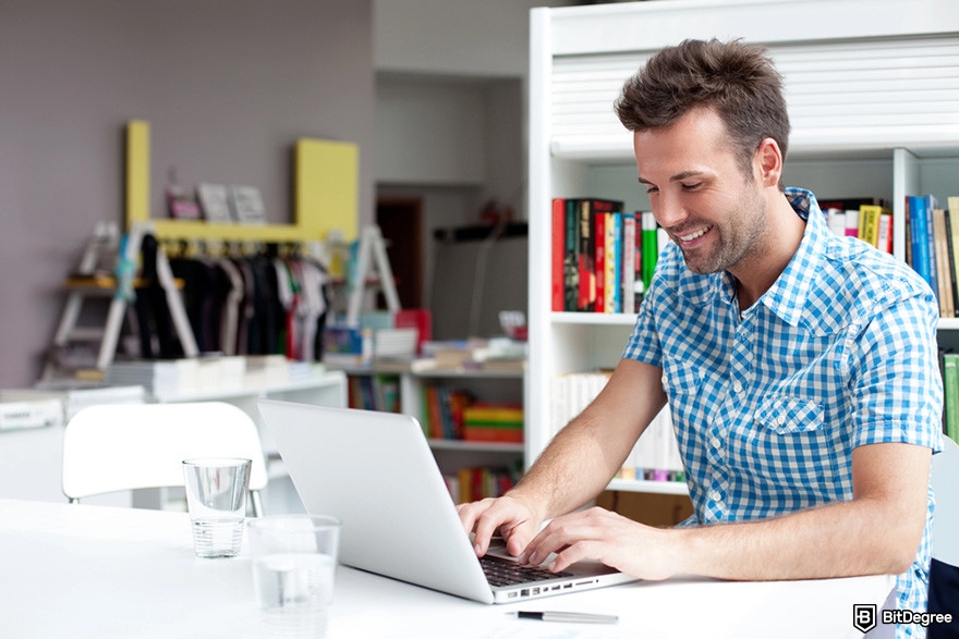 Free crypto rewards: a person working on a laptop.