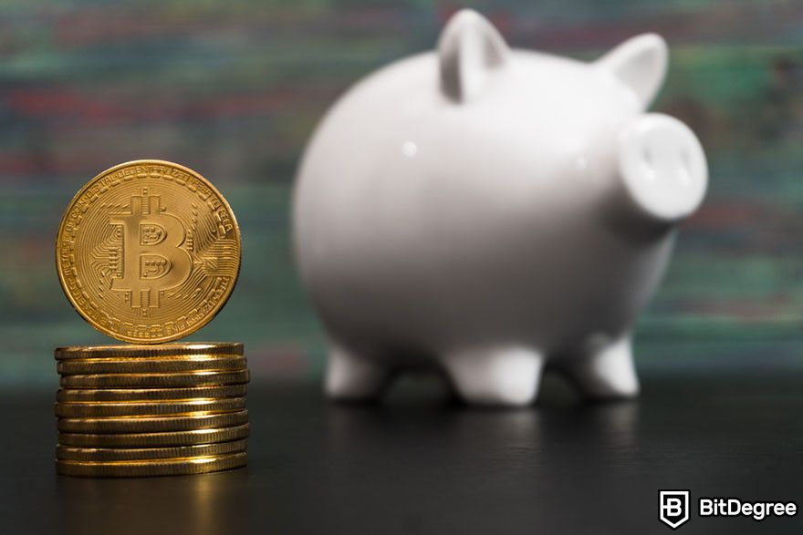 Future of cryptocurrency: A stack of Bitcoin token in front of a white piggy bank.