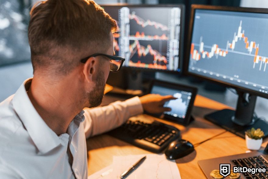 Grid trading bot: a trader looking at charts.