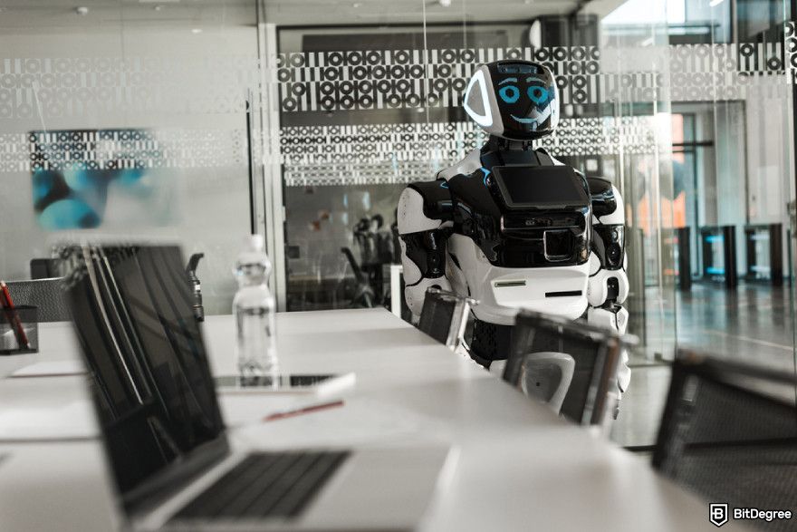 Guide to use AI in crypto arbitrage: a humanoid robot standing near desk in conference hall.