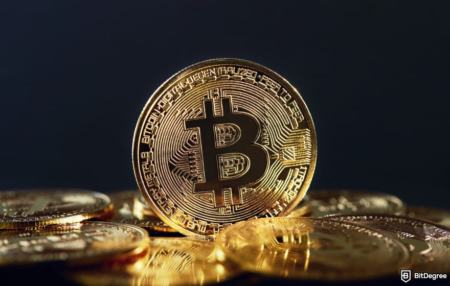 Halal crypto list: photo of a Bitcoin on top of a Bitcoin stack.