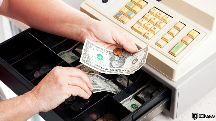 How to add money to Revolut: money on cash register.