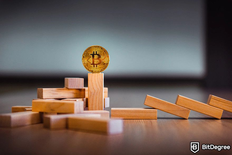 How to borrow against Bitcoin: a BTC coin on a stack of dominos.