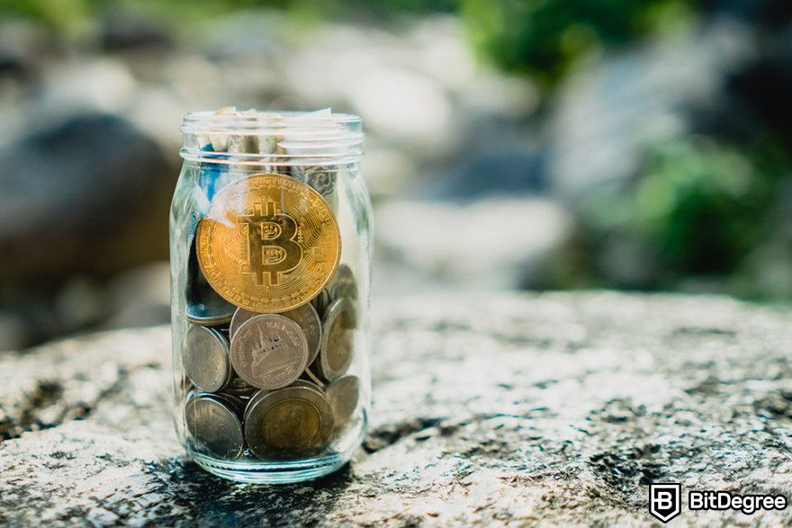 How to borrow against Bitcoin: a glass jar filled with coins, with a Bitcoin coin visible at the top.