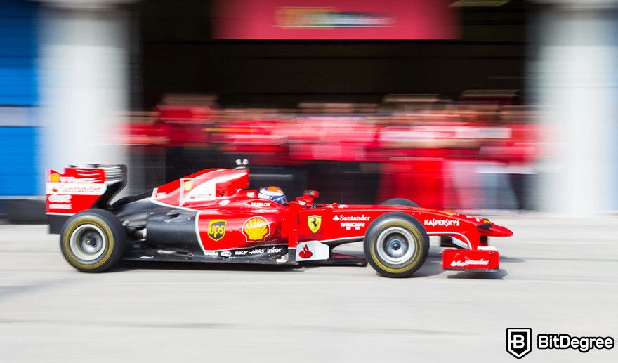 How to borrow against Bitcoin: a red Formula 1 race car speeding down a track.