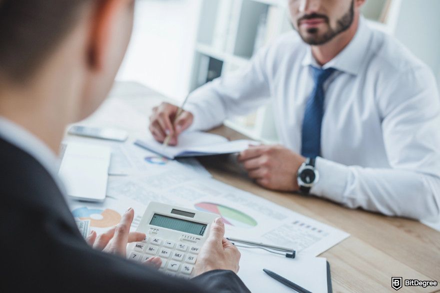 How to buy Bitcoin with prepaid card: two men discussing finances.