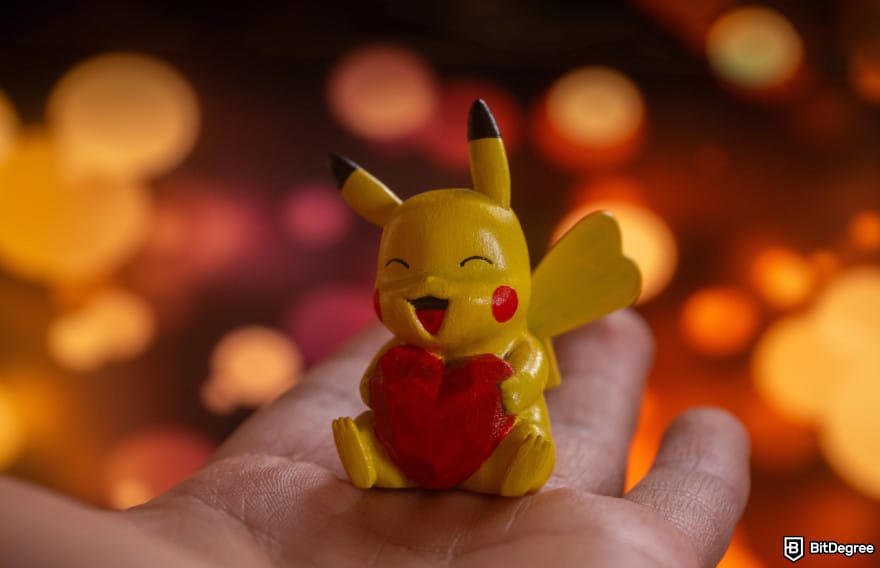 How to buy CARDS token: hand holding Pikachu to illustrate choosing CARDS.