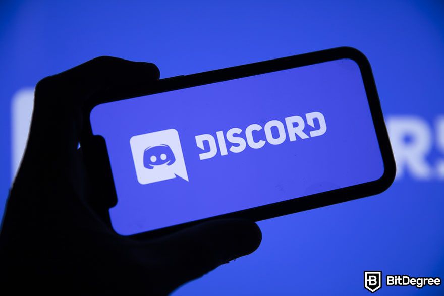 How to buy new crypto before listing: Discord logo on a mobile phone.