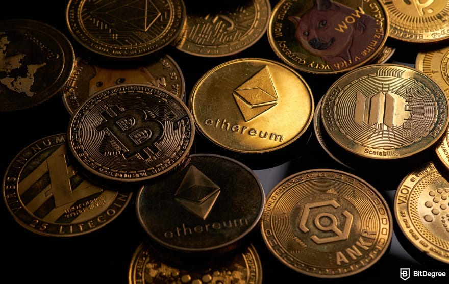 How to buy RXS coin: various crypto coins laid out on a dark surface.