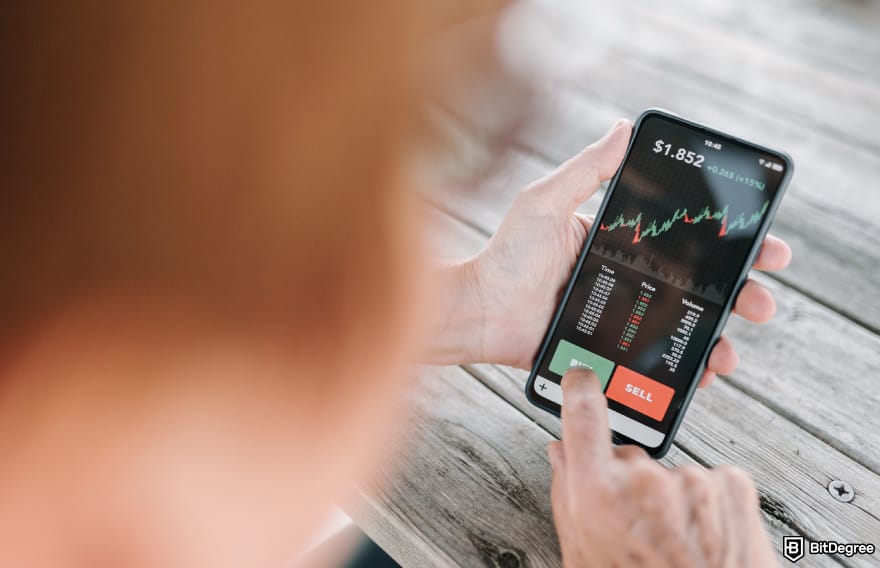 How to buy RXS coin: woman holding a smartphone buying crypto.