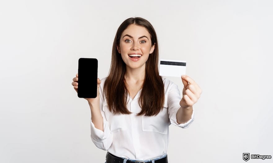 How to buy Supra crypto: a woman showing her phone and an ID card.
