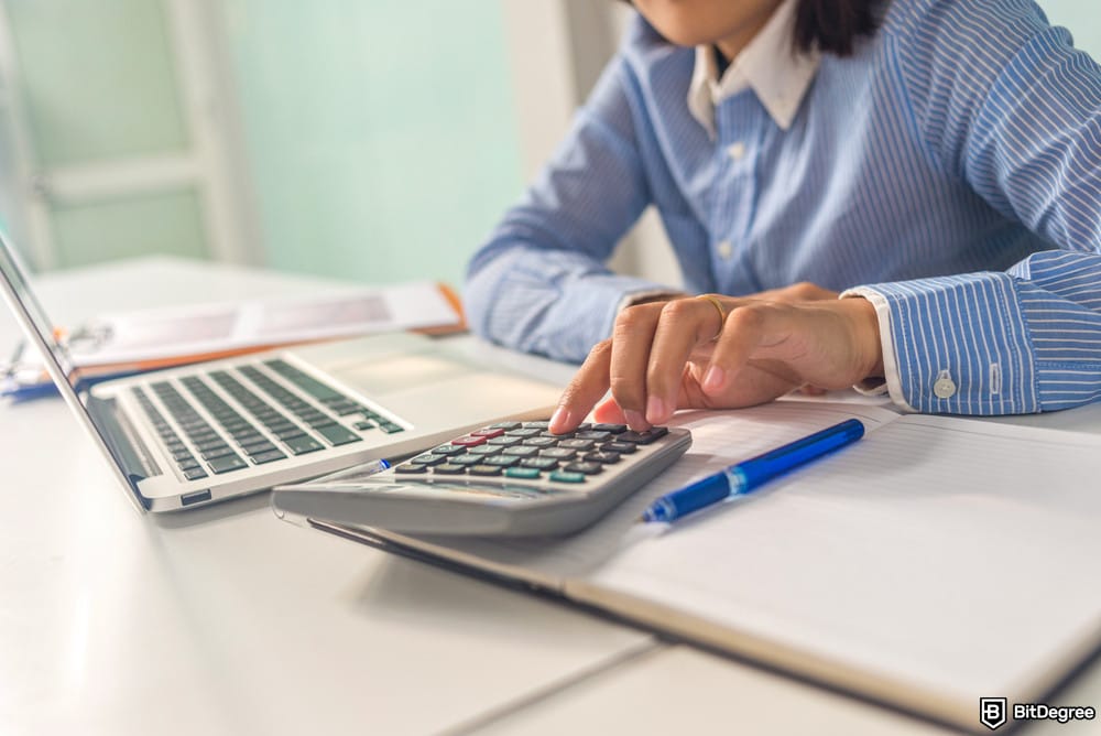How to buy USDT with PayPal: a woman using her calculator.