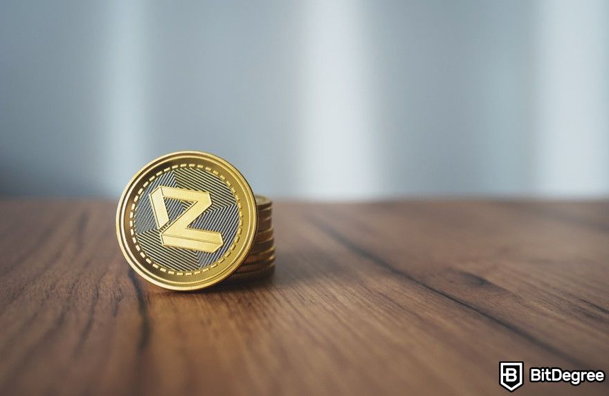 Cách mua Zilliqa: Một đồng xu ZIL trên bề mặt gỗ.