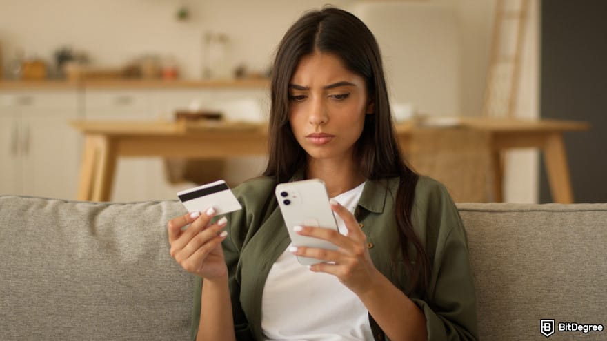 How to deposit money into crypto exchange: a person holding a phone and a credit card. How to deposit money into crypto exchange: a person holding a phone and a credit card.
