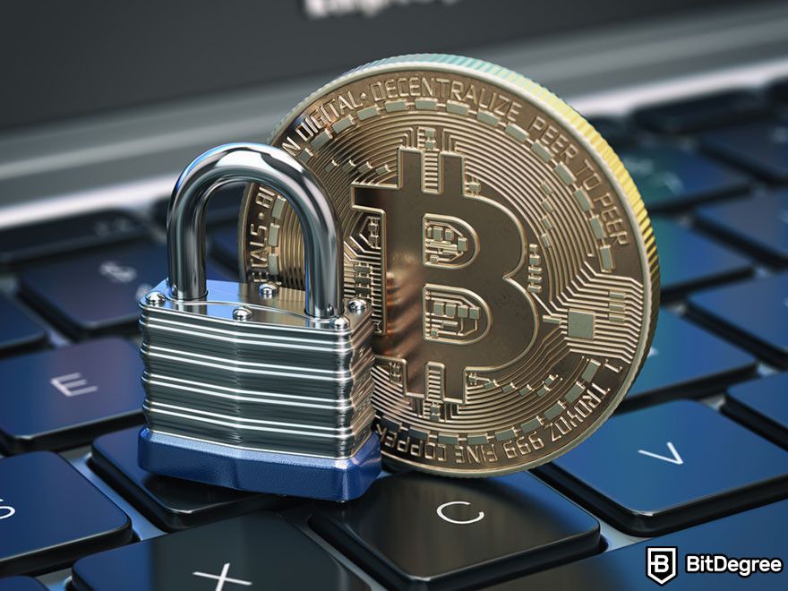 How to get a crypto wallet: A Bitcoin token and a padlock on a keyboard.