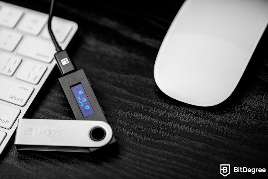 How to get a crypto wallet: A Ledger wallet connected with a USB cable.