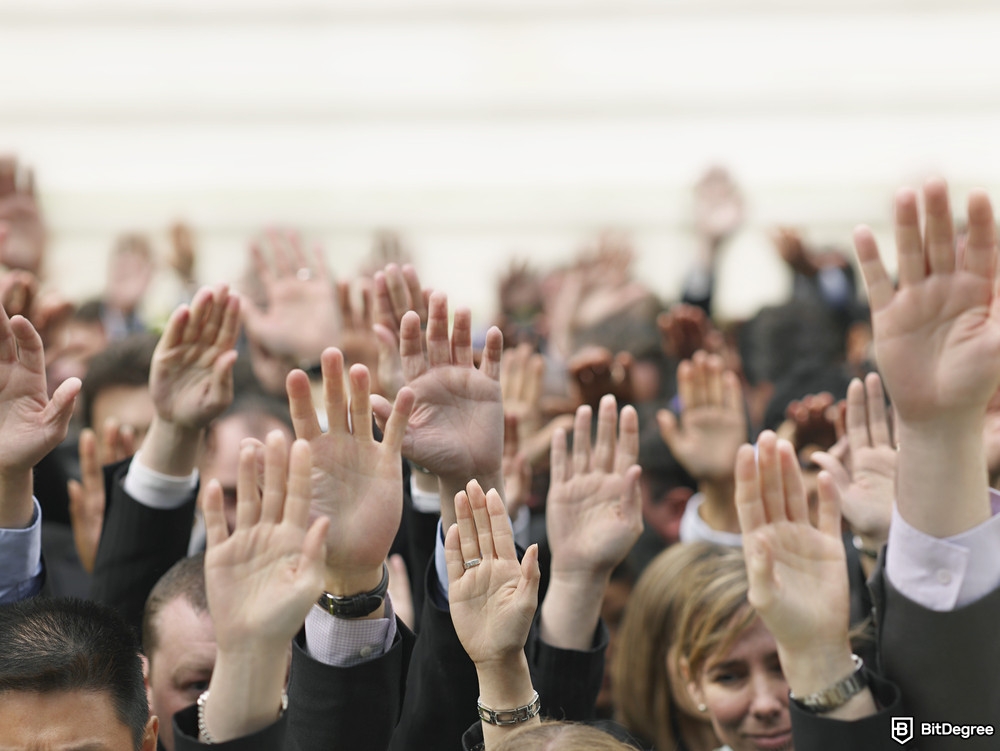 How to get free money online: people raising hands.