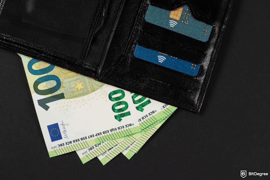 How to get into crypto: a wallet with euros sticking out.