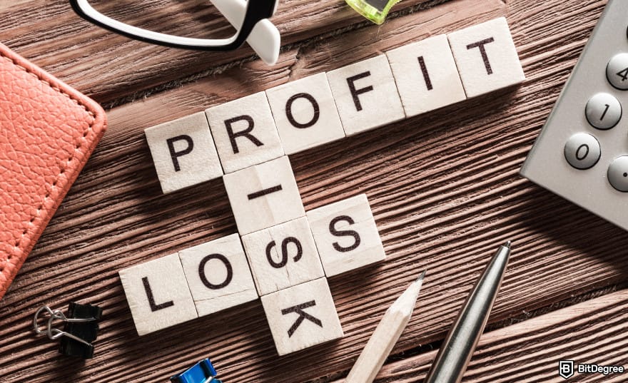 How to leverage trade crypto: wooden blocks spelling PROFIT, LOSS, and RISK.