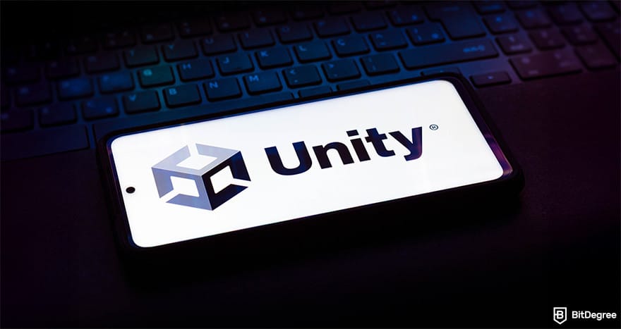 How to make a video game: smartphone with Unity logo on the screen.