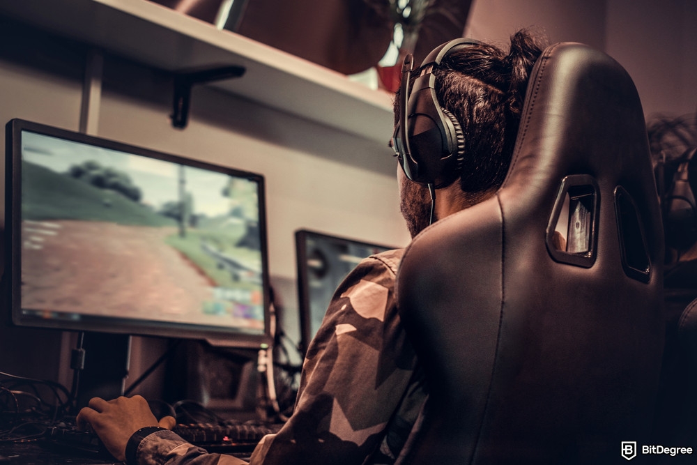 How to make passive income with crypto: a professional gamer playing a game on his PC.