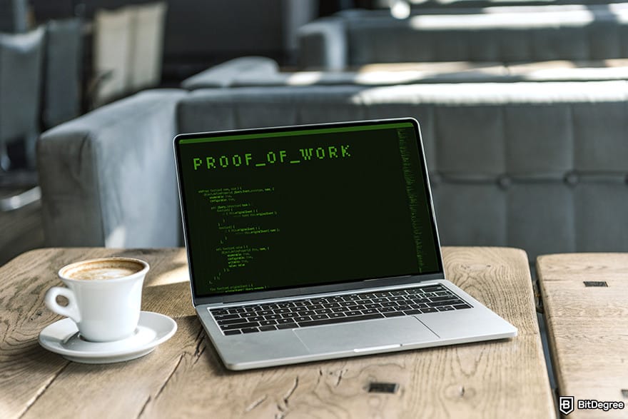How to mine cryptocurrency: laptop mining cryptocurrency in a cafe.