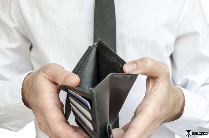 How to open Binance corporate account: a man opening an empty wallet.