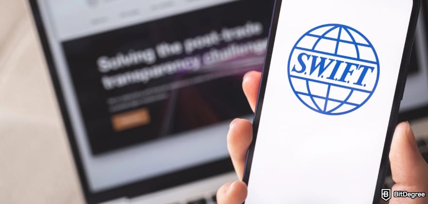 How to send money from UAE to Philippines: the SWIFT logo on mobile screen.